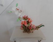 Fabric Orchids on a Tree Trunk Floral Arrangement