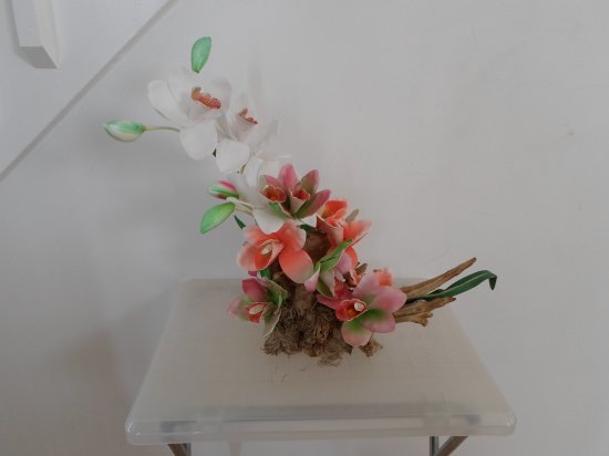 Fabric Orchids on a Tree Trunk Floral Arrangement