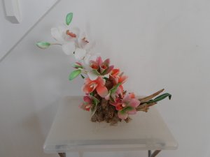 Fabric Orchids on a Tree Trunk Floral Arrangement